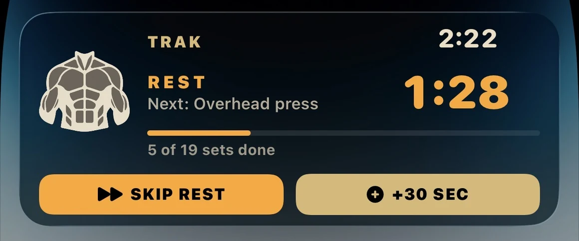 Lock screen Live Activity during rest: 1:28 remaining before overhead press, with Skip Rest and plus thirty seconds buttons.